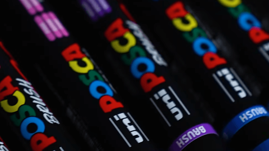 POSCA Brush PC-5BR paint pens in various colors with semi-flexible brush tips, ideal for detailed artwork and creative projects.