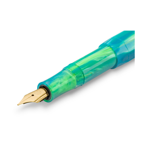 Close-up of the gold-plated medium nib on the Kaweco Marble Ocean fountain pen, white background