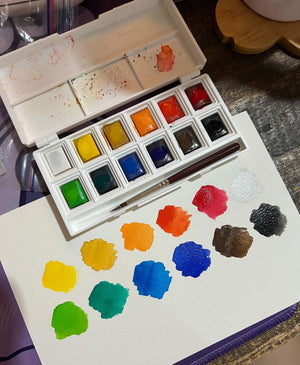 Elements Watercolour 12 Half Pan Set in use with colour swatches
