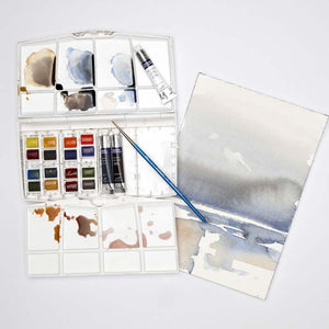 Cotman Watercolours Painting Plus set with 16 half pans, 3 tubes, brush, and watercolor artwork.