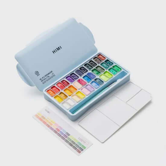 HIMI Twin Cup Gouache Set - 36 Colours + 3 Brushes (Ice Blue Case) displayed with vibrant color options and paintbrushes.
