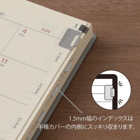 Midori Index Clip<S> Chiratto Silver attached to planner for easy customization and organization.
