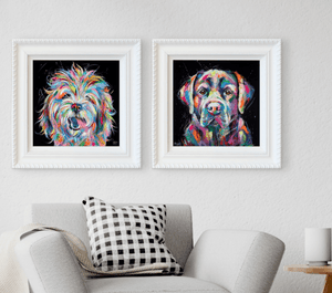 Colorful bespoke pet portraits in white frames by bradburyART, showcasing vibrant dog illustrations, enhancing modern home decor.