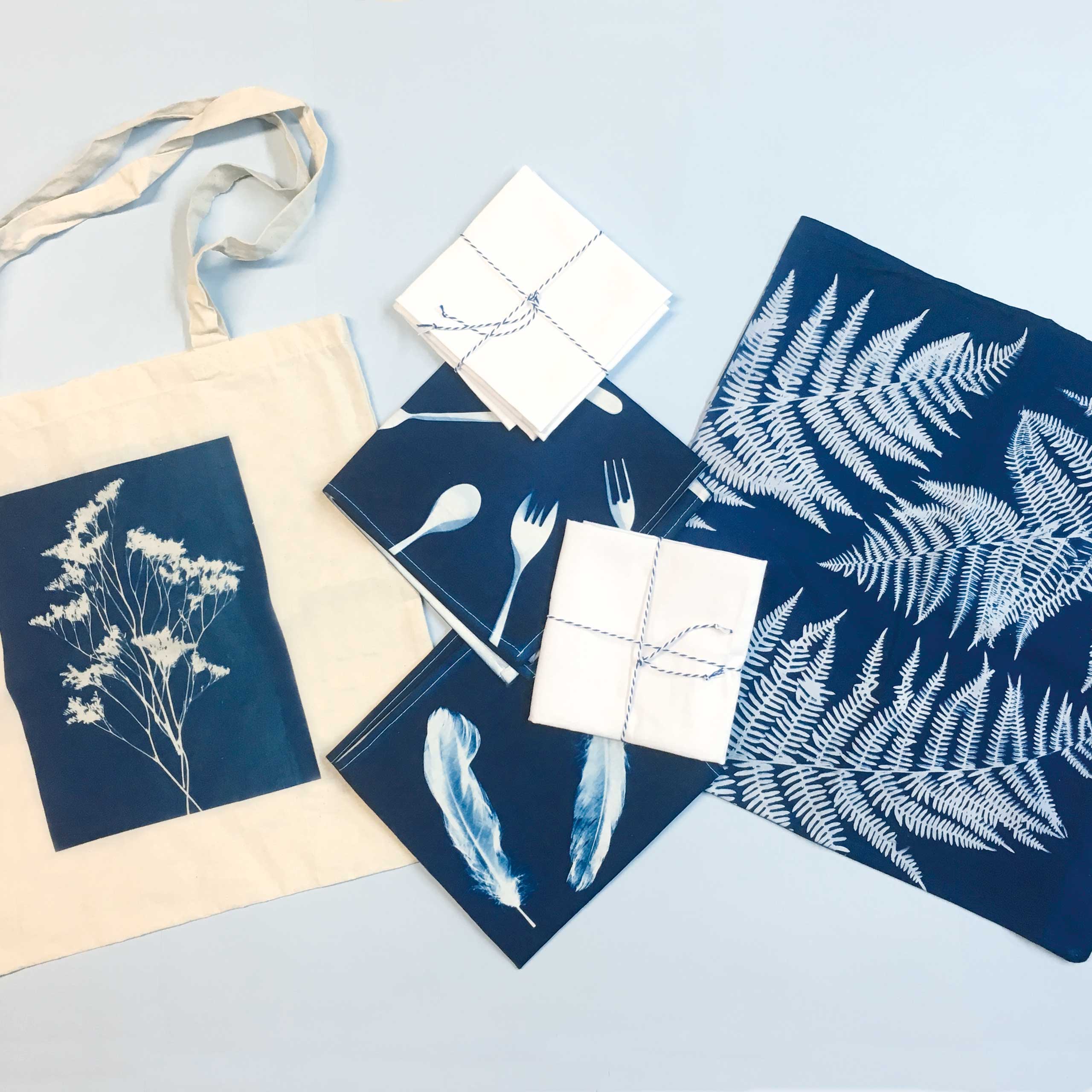 Cyanotype prints on tote bags and fabric – blue botanical sun printing on textiles
