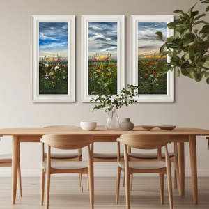 Triptych art series 'Summertime Reverie' by Kimberley Harris, featuring luminous wildflower landscapes above a dining table.