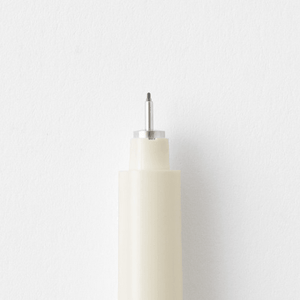 Close-up of the MD Drawing Pen tip showcasing water-resistant fine liner design for precise writing with MD Notebooks.