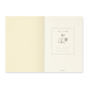 Open Midori Diary – Yummy Food Memory Journal showing rabbit illustration on cream MD Paper
