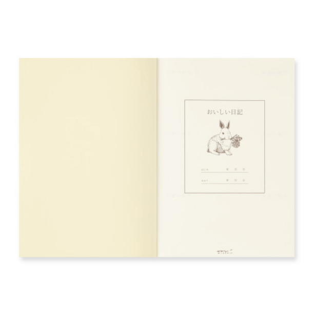 Open Midori Diary – Yummy Food Memory Journal showing rabbit illustration on cream MD Paper