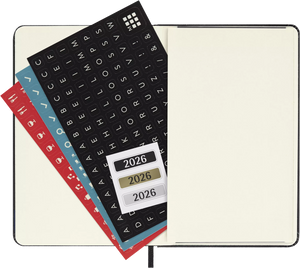 Open Moleskine 2026 Pocket Weekly Planner with stickers and labels, showcasing durable hardcover and compact design.