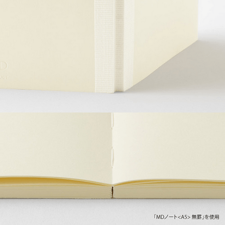 MD Notebook A6 blank B showcasing its flat binding and smooth pages for writing.