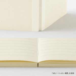 MD Notebook lined A6 showing the open pages with lined paper and flat binding for effortless writing.