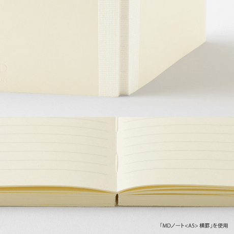 MD Notebook lined A6 showing the open pages with lined paper and flat binding for effortless writing.
