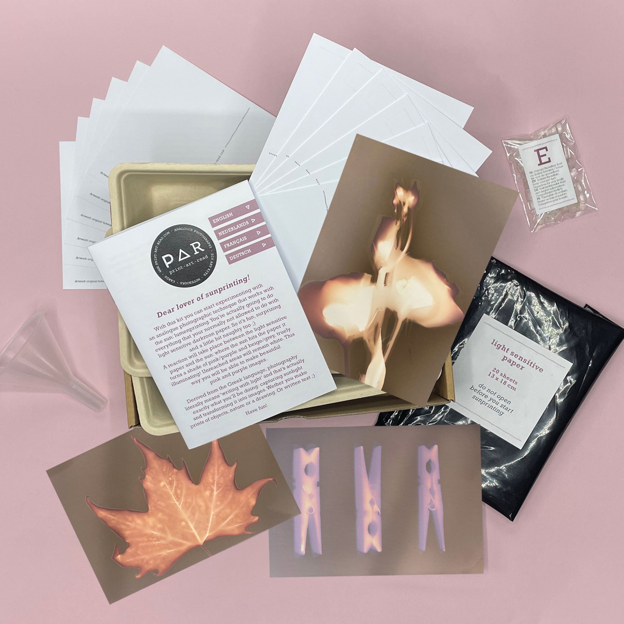 Contents of the PAR lumen printing kit – light-sensitive papers, instructions, tray and fixative