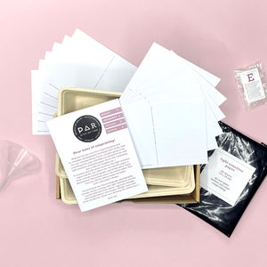 Lumen kit contents with blank postcards, instructions and light-sensitive paper pouch