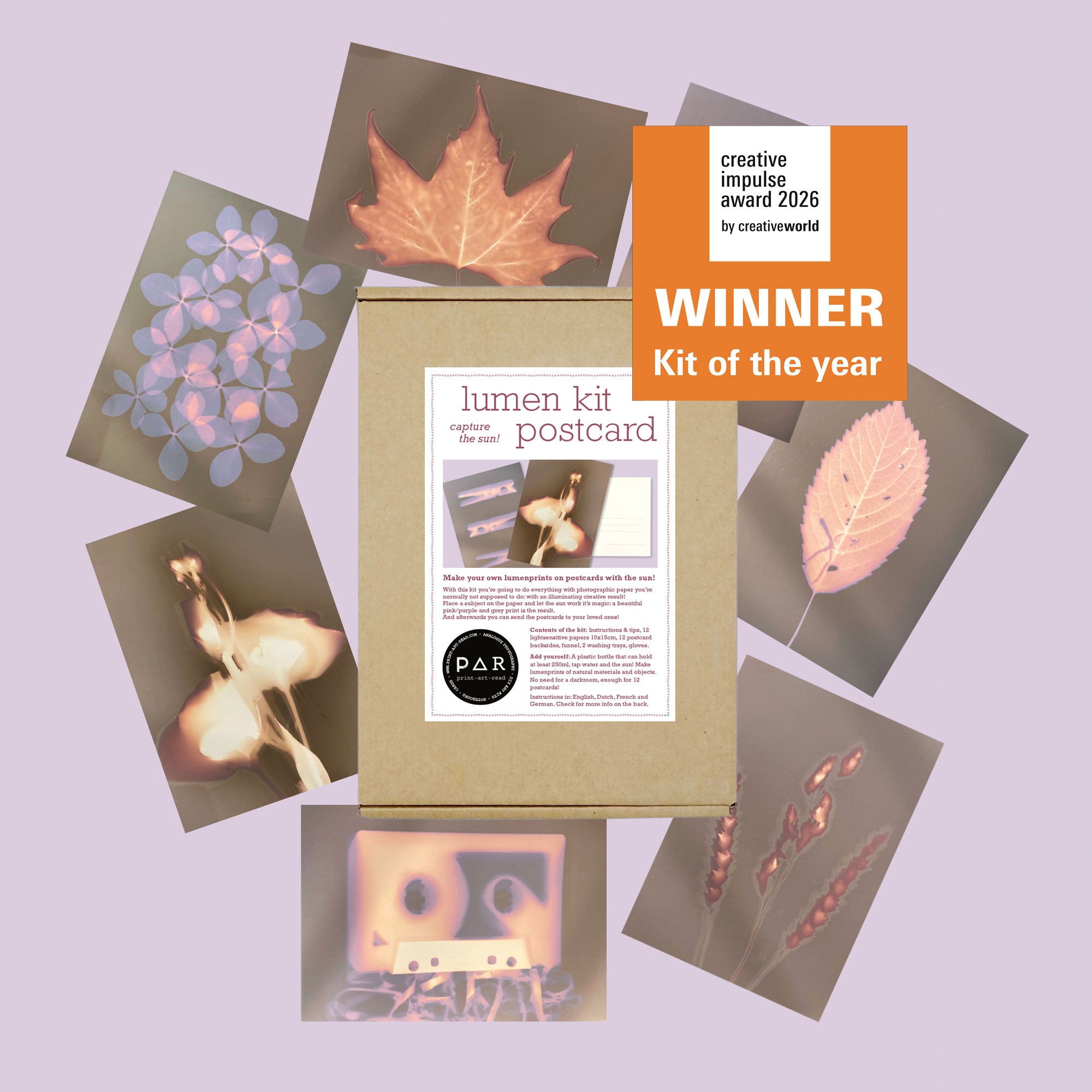 PAR Lumen Print Kit box surrounded by finished sun print postcards – Kit of the Year award winner