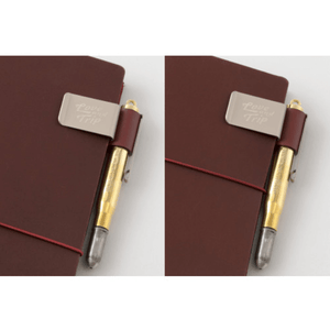 TRAVELER’S notebook Pen Holder – LOVE AND TRIP Red with engraved metal clip and red leather, shown on a notebook with a secured pen.