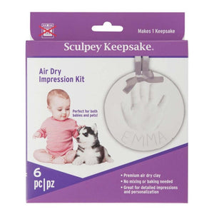 Sculpey Keepsake Air-Dry Kit packaging featuring a baby and a pet with clay handprint impression.