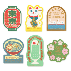 TRAVELER’S Limited Edition Sticker Set – TOKYO featuring iconic Tokyo culture elements like a beckoning cat, sushi, and ramen.
