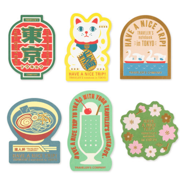 TRAVELER’S Limited Edition Sticker Set – TOKYO featuring iconic Tokyo culture elements like a beckoning cat, sushi, and ramen.
