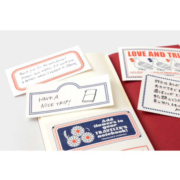 TRAVELER’S notebook Refill – LOVE AND TRIP with red cover, message cards, and MD PAPER Cream pages for writing.