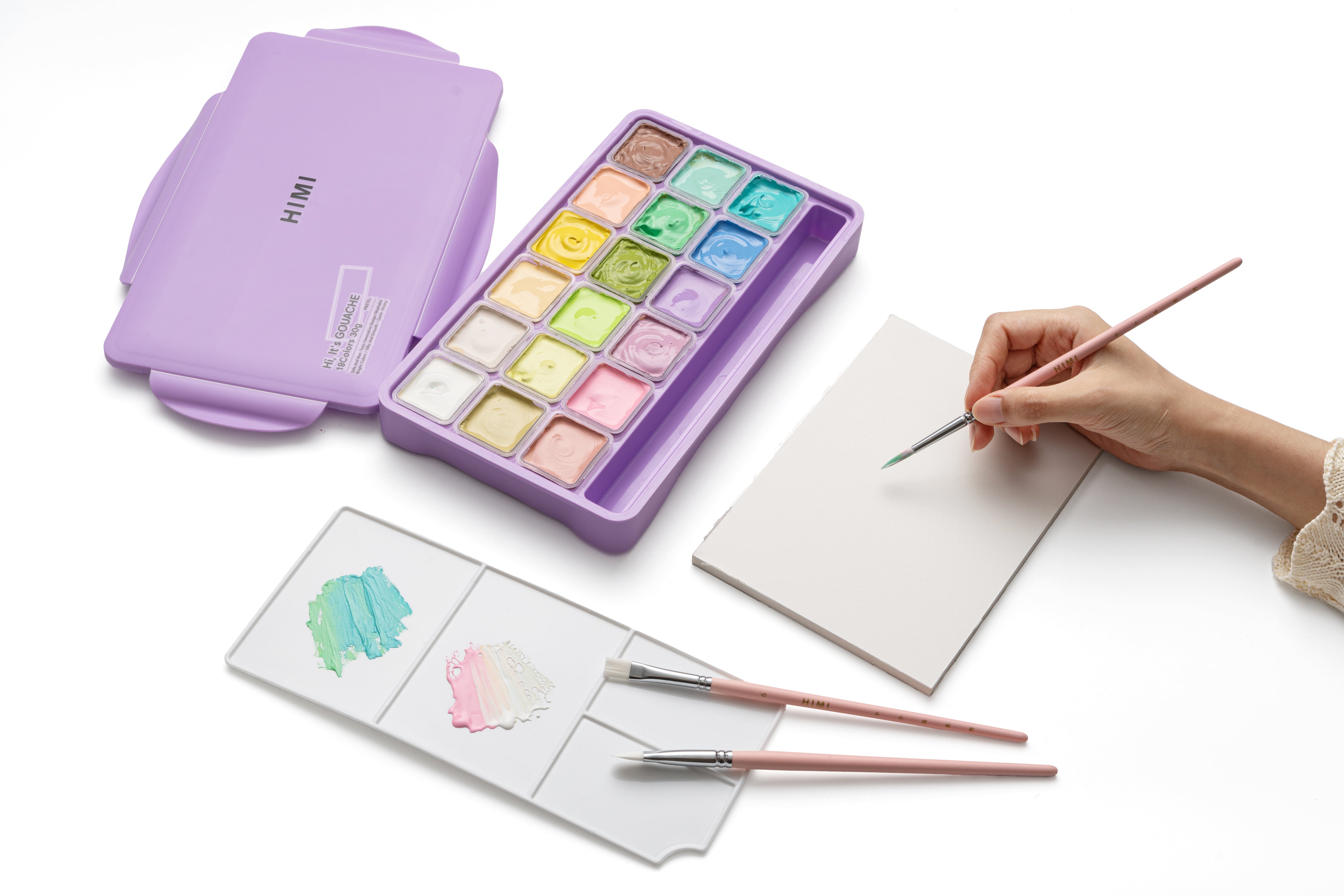 HIMI Jelly Cup Gouache Set - 18 Colours (Purple Case - Pastel Edition) shown in use.