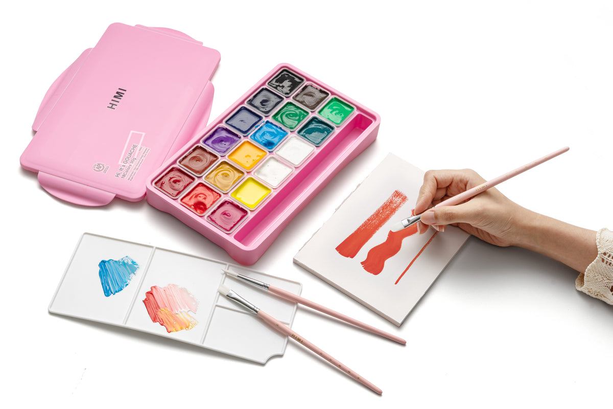HIMI Jelly Cup Gouache Set - 18 Colours + 3 Brushes (Pink Case) shown in use.