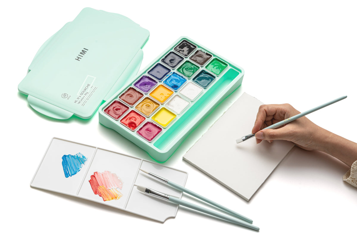 HIMI Jelly Cup Gouache Set - 18 Colours + 3 Brushes (Green Case) shown in use.