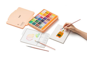 HIMI Twin Cup Gouache Set - 48 Colours + 3 Brushes (Peach Fuzz Case) shown in use.
