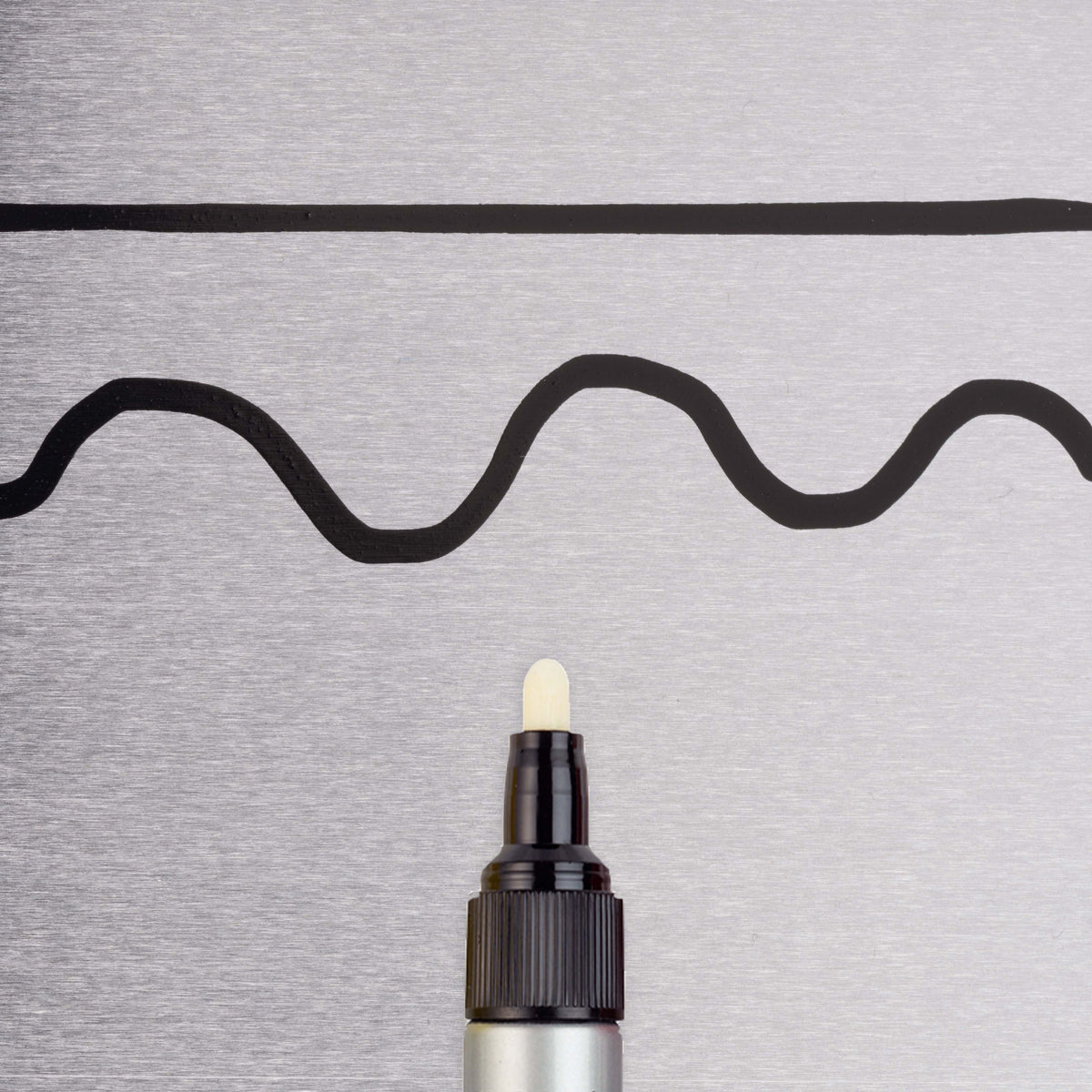 Sakura Paint Marker Low Halogen black line sample on metal