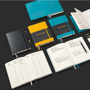 Leuchtturm Bullet Journal Edition 2 – Medium (A5) Hardcover, Turquoise25 notebooks displayed with open and closed views.