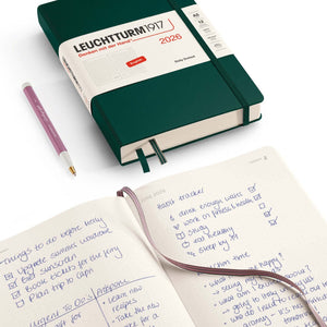 Leuchtturm Daily Planner 2026 – Dotted edition with a dotted page open showcasing checklist and notes. Includes pen and closed planner.
