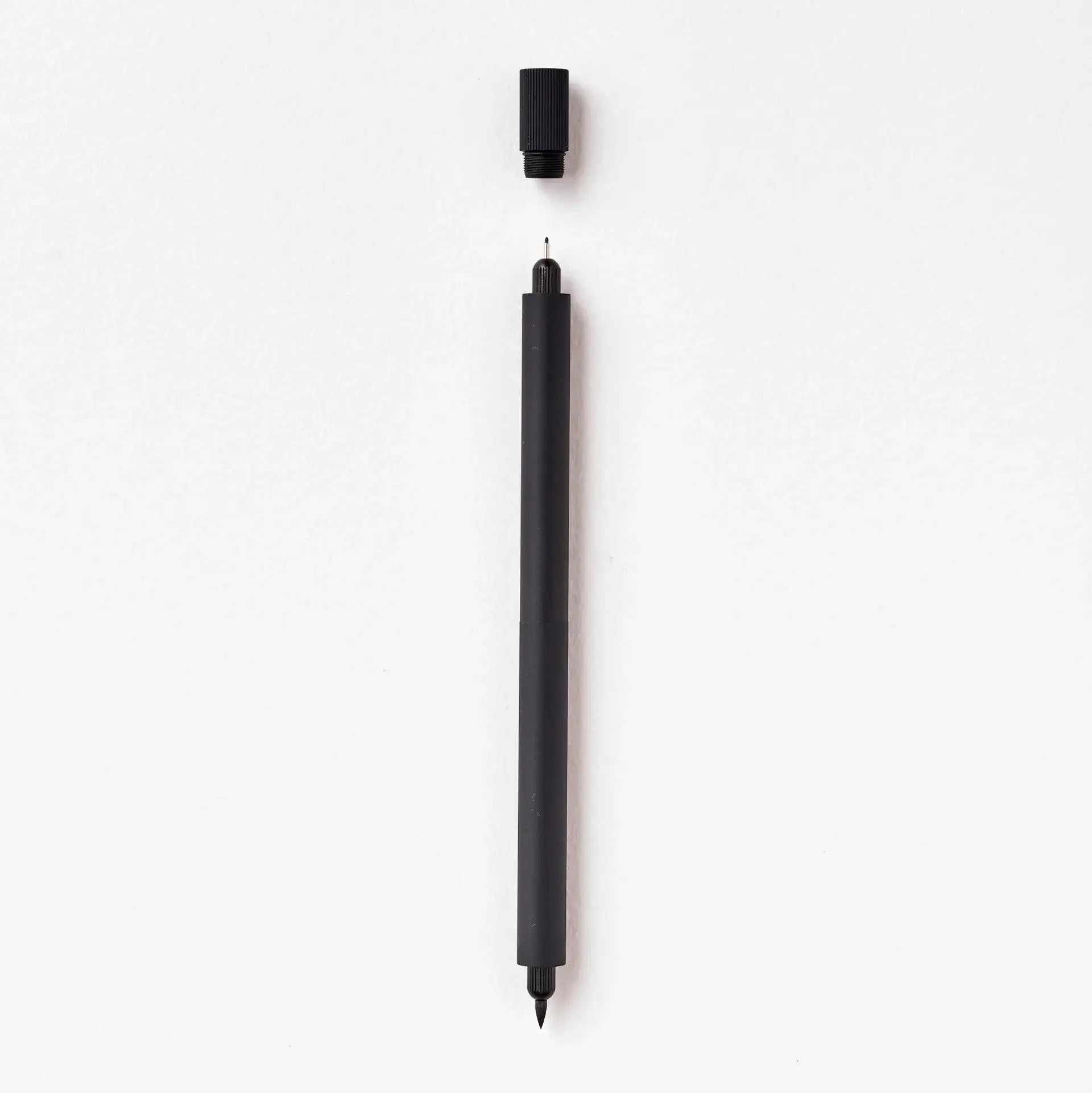 Tom’s Studio Lumos Duo Tip Refillable Fineliner & Brush Pen, showing interchangeable tips and sleek design, ideal for artists.