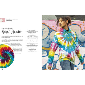 Person wearing a colorful tie-dye spiral hoodie from Modern Tie Dye – Abi Patten (Search Press) against a graffiti wall.