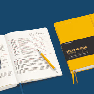 Leuchtturm1917 New Work Journal open, showing the weekly reflection and planning pages