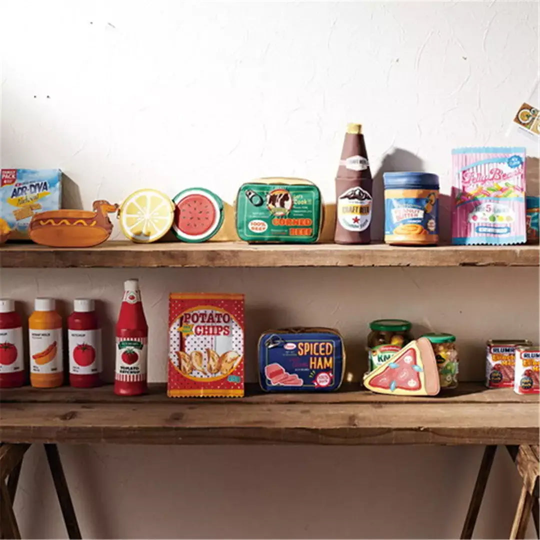 Variety of novelty food-themed storage pouches on shelves, including ketchup, potato chips, and fruit designs, perfect for organizing.