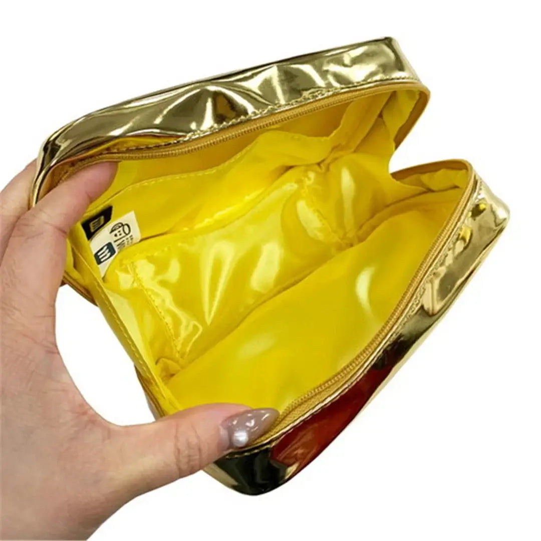 Open gold Yup! Butter Zipped Pouch showing yellow interior, perfect for organizing pens, makeup, or tech gear. Fun and functional design.