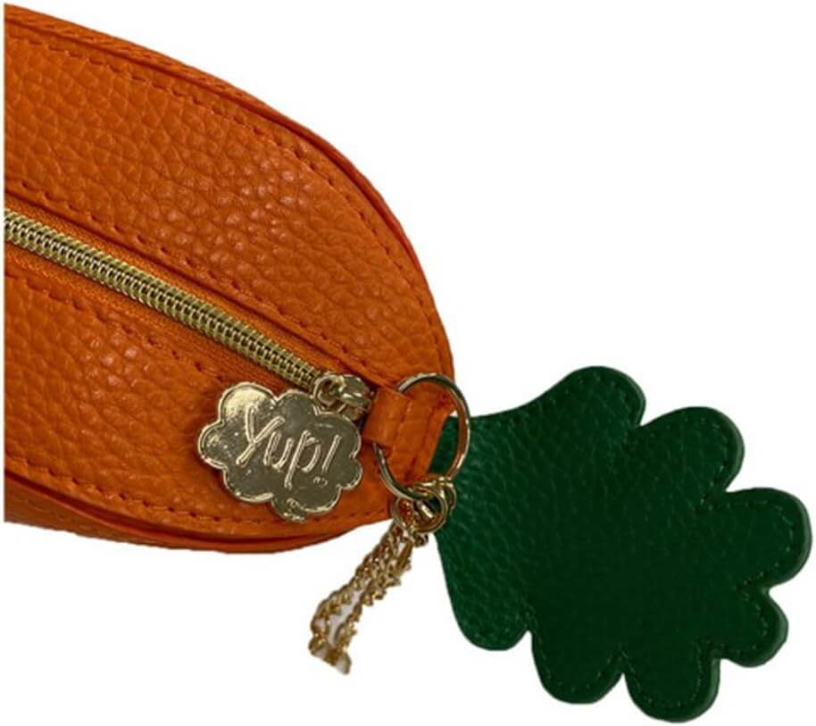 Yup! Carrot Zipped Pouch close-up showing textured material, gold zip and tag, green leafy design. Fun orange organizer for pens or makeup.