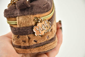 Yup! Chocolate Cake Zipped Pouch with soft touch feel and gold zipper, ideal for organizing pens, makeup, or tech gear.