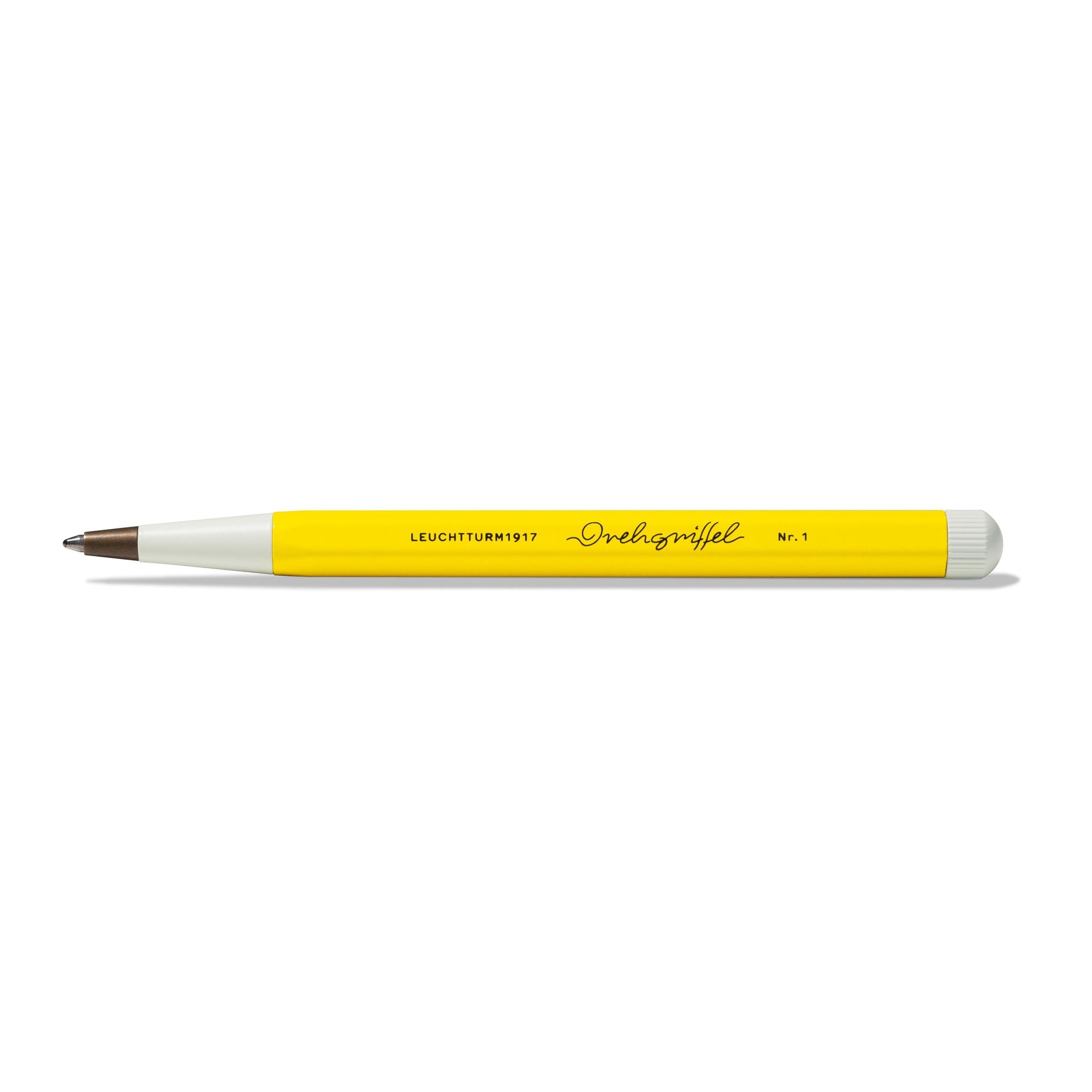 Leuchtturm1917 Drehgriffel Nr. 1 Ballpoint Pen with yellow hexagonal barrel and white tip, elegant design inspired by 1920s aesthetics.