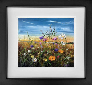 Vibrant wildflowers in a field under a bright blue sky, framed artwork by Kimberley Harris.