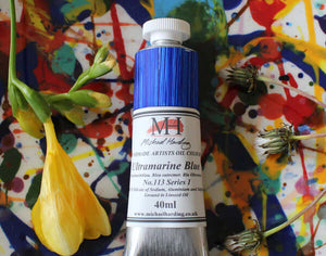 Michael Harding Professional Oil Paint 40ml Ultramarine Blue tube on colorful artistic background